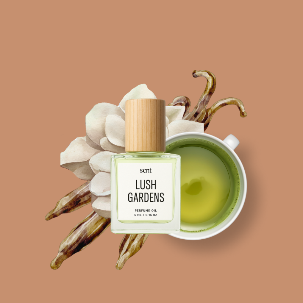 Perfume oil bottle labeled 'Lush Gardens' with a cup of tea and flowers on a brown background